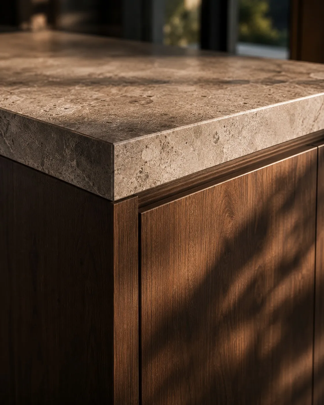 Junction of the stone worktop and cabinetry.